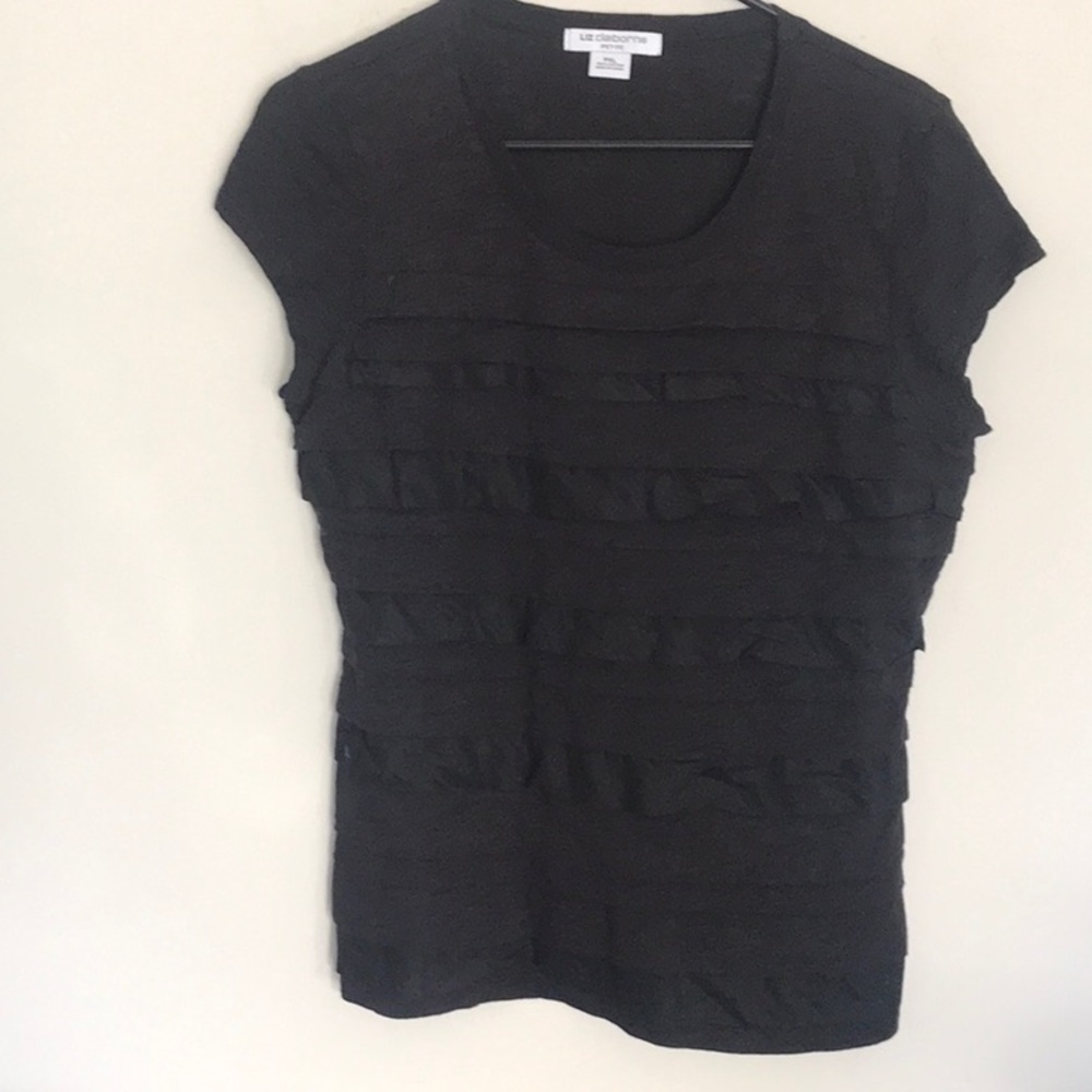 Cute black ruffled shutter style top.  Size XLP